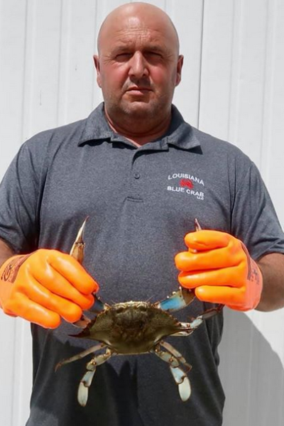 Sheb Callahan holding large blue crab